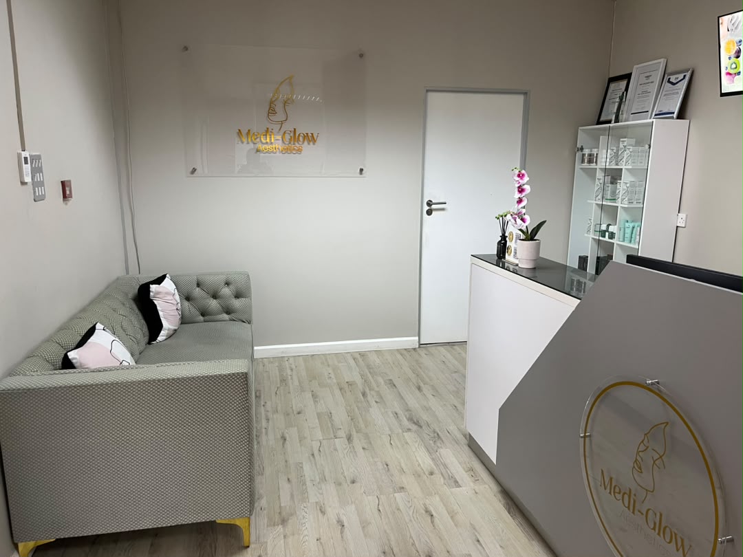Medi-Glow reception with gold logo sign
